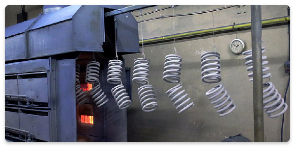 coil-springs-being-heat-treated-in-an-inline-oven
