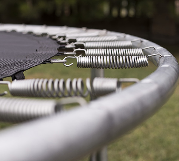 helical extension springs on a trampoline